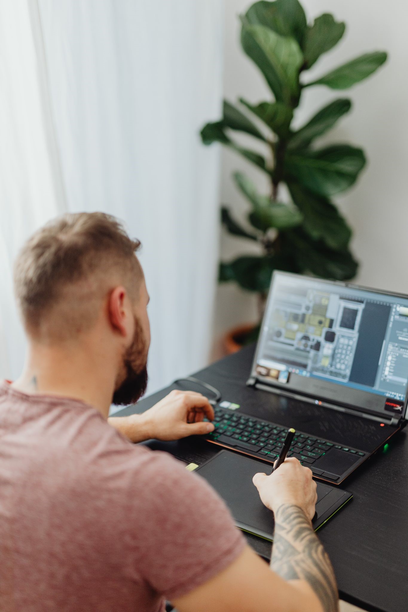 https://www.pexels.com/photo/man-holding-black-stylus-pen-5904073/