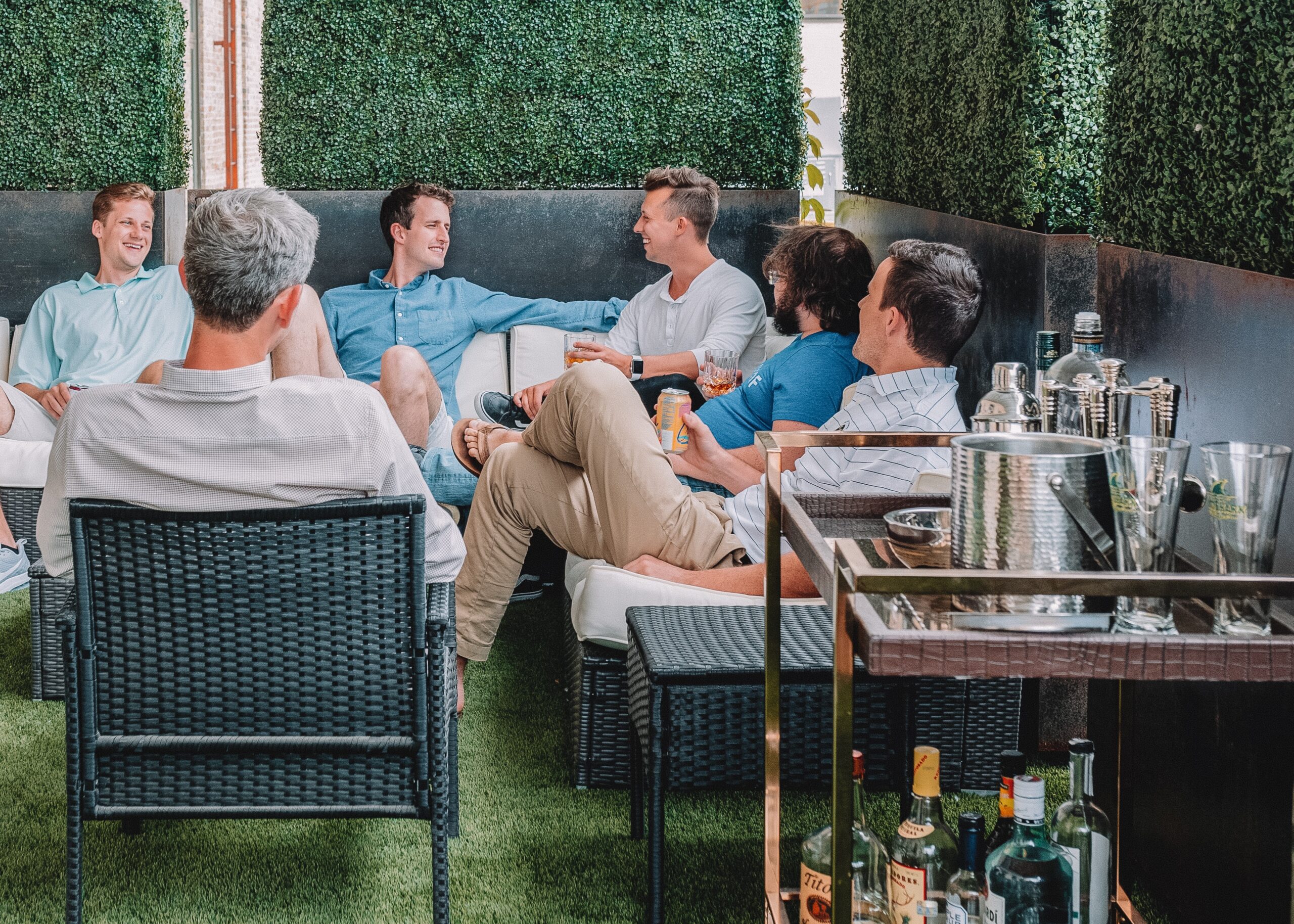 men sitting in backyard