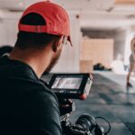 man taking photo of woman