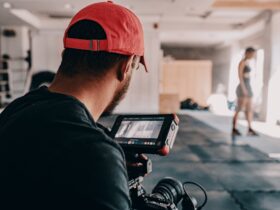 man taking photo of woman