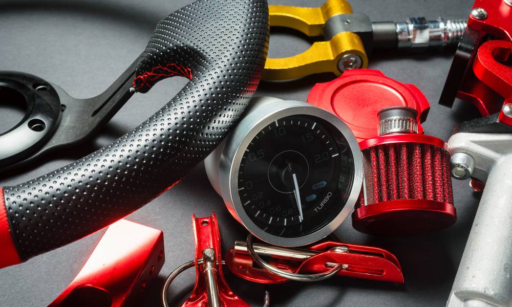 A close-up of red and silver sport car tuning equipment and accessories used for professional racers.
