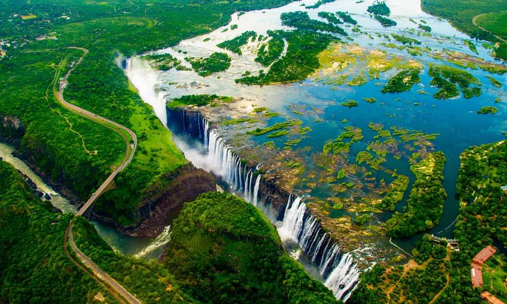 An overhead view of the entirety of Victoria Falls, on the border between Zambia and Zimbabwe.