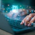 A person typing on a laptop keyboard with a glowing digital interface overlay showing an AI icon, brain graphic, and data nodes.