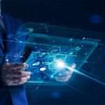 A businessperson is holding a modern virtual interface banking mobile device with an icon network connection.