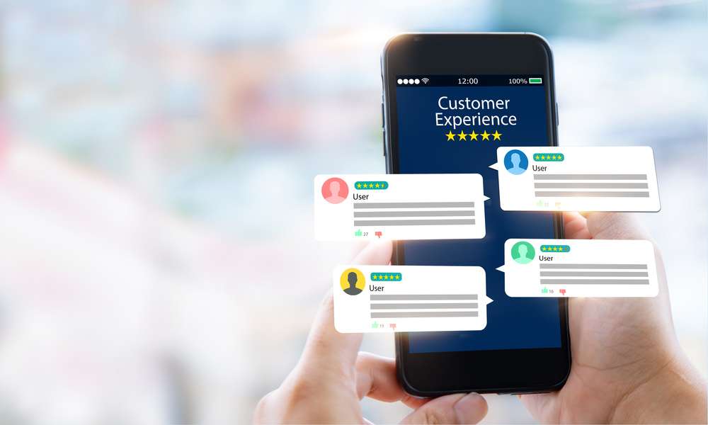 A pair of hands holds a smartphone with the words "Customer Experience" and five stars on it. User reviews float in the air.